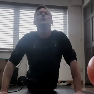 EMS session in progress, client in a press-up position