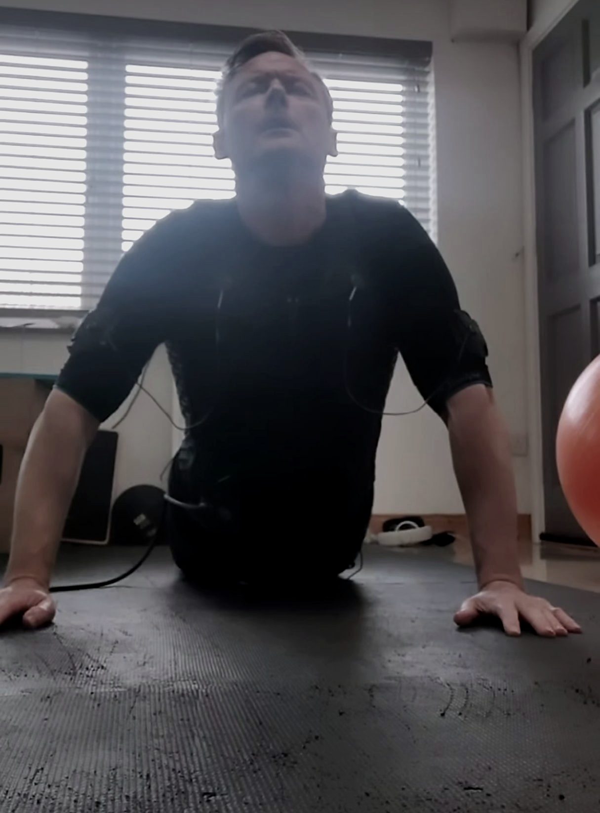 Gerard in the EMS suit, mid press-up